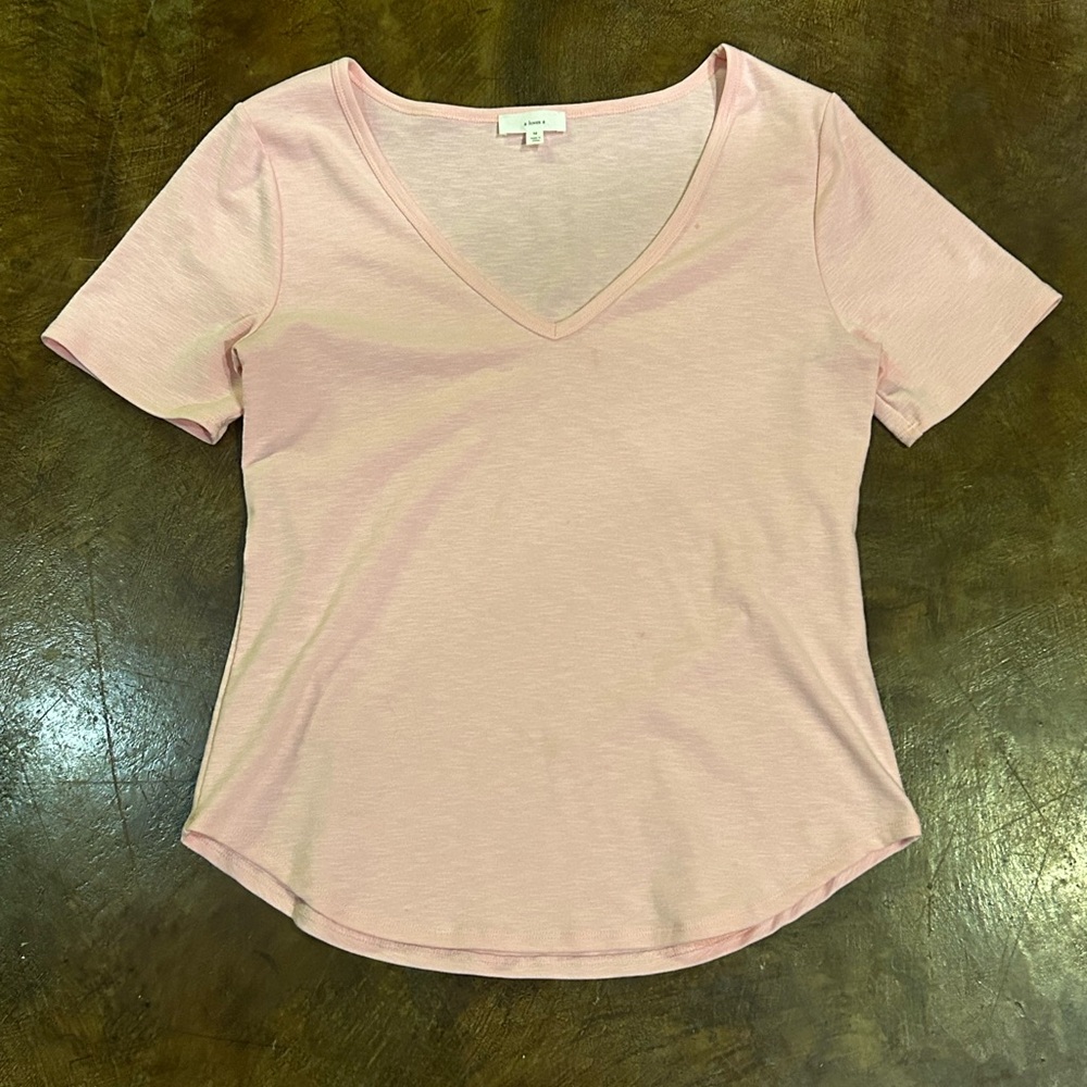 A loves a pink top